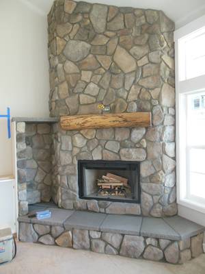 Masonry wood fireplace with log niche